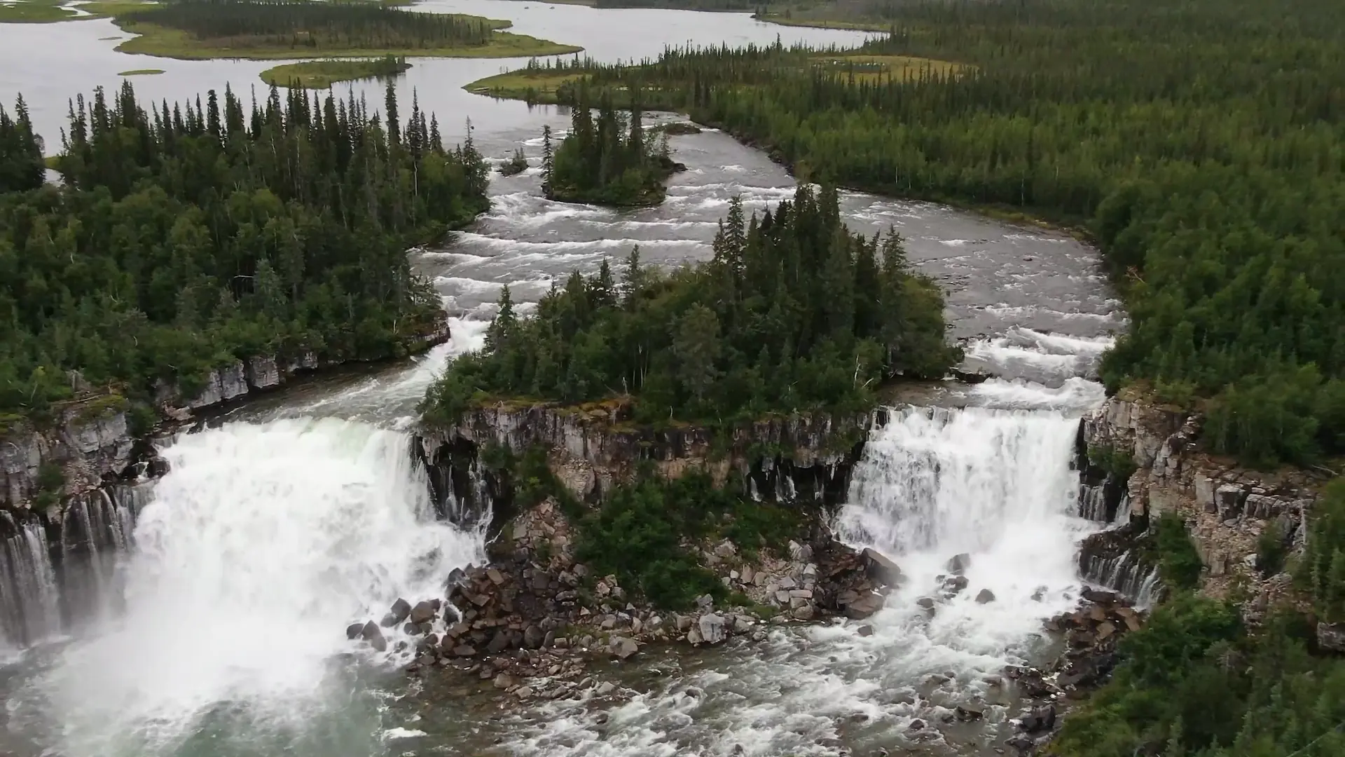 An overhead drone photography image of Whatì Falls.